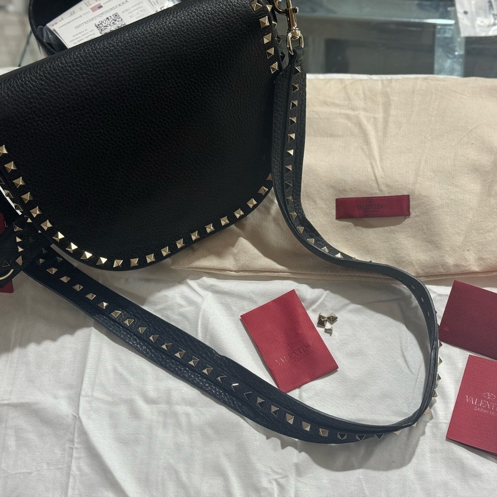 VALENTINO GARAVANI
Grained Calfskin Rockstud Saddle Bag Black